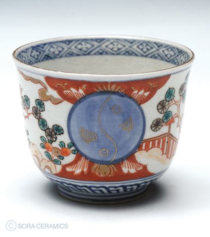 Imari choko cups, blue and white with polychrome designs
