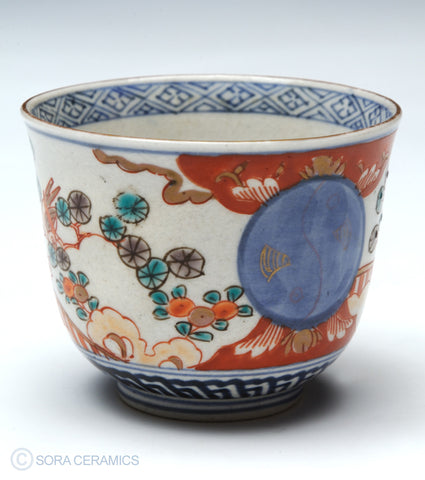 Imari choko cups, blue and white with polychrome designs