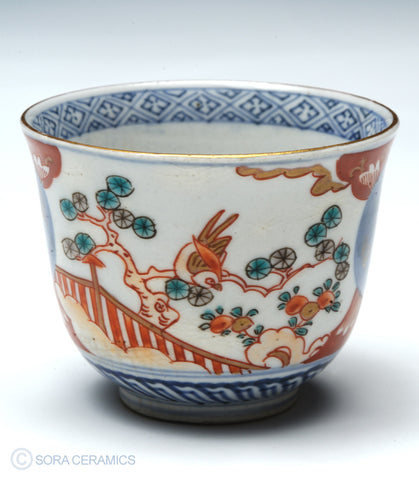 Imari choko cups, blue and white with polychrome designs