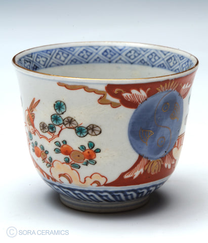 Imari choko cups, blue and white with polychrome designs