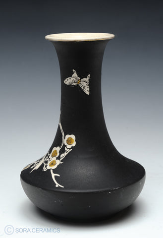 Satsuma vase, black matte finish, white interior and floral motifs