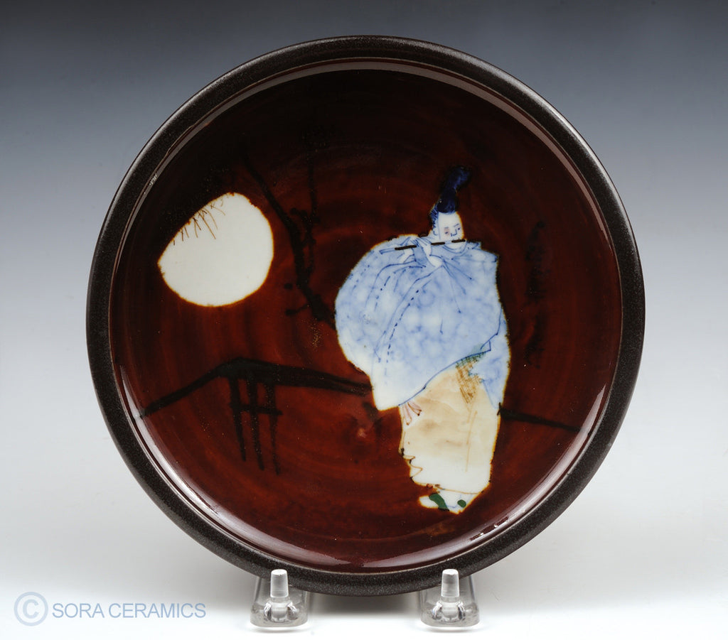 pottery dish, deep brown with Shinto flute player and moon