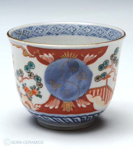 Imari choko cups, blue and white with polychrome designs